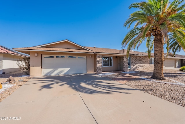 single story home featuring a garage