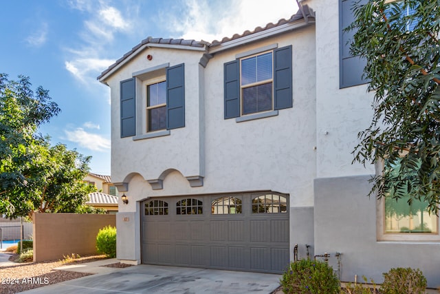 mediterranean / spanish-style house featuring a garage