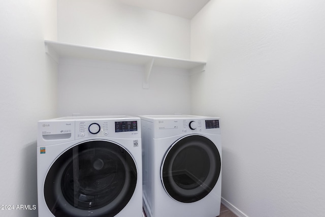 laundry room with independent washer and dryer