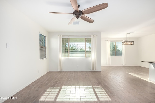 unfurnished room featuring wood-type flooring and ceiling fan