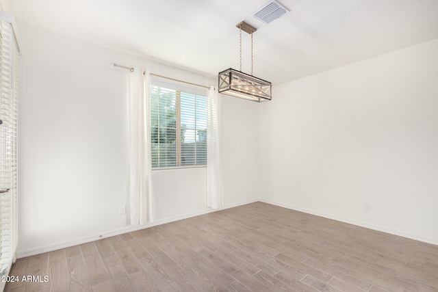 spare room with light hardwood / wood-style floors