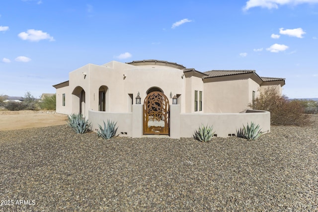 view of front of house featuring stucco siding