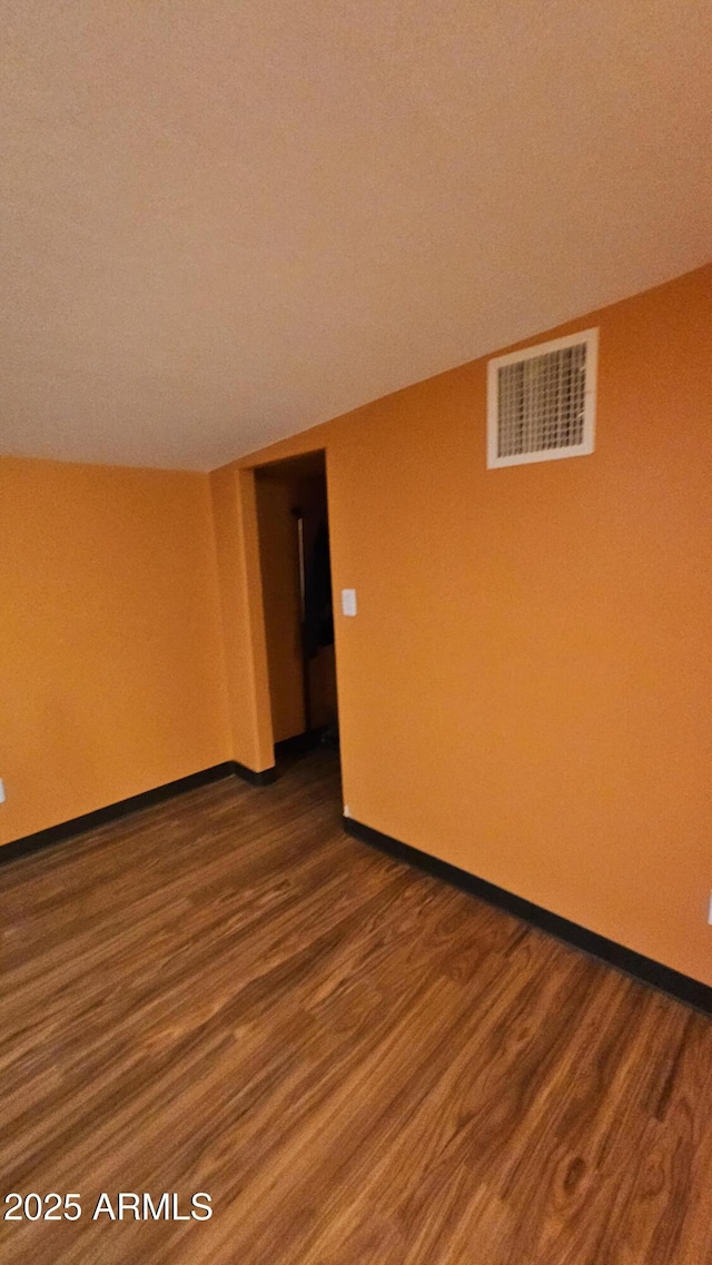 30940 N Varnum Rd, San Tan Valley, AZ 85143 - unfurnished room featuring dark wood finished floors and baseboards