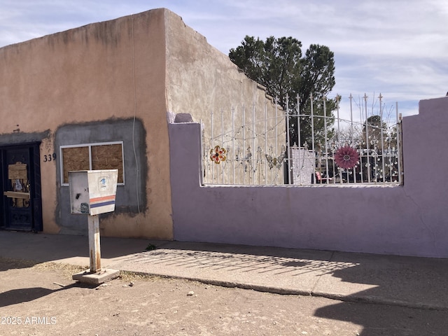 339 E 6th St, Douglas, AZ 85607 - view of home's exterior with fence and stucco siding