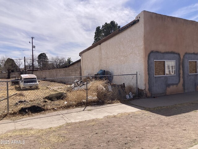 339 E 6th St, Douglas, AZ 85607 - view of home's exterior with stucco siding and fence