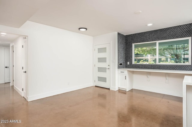 interior space featuring concrete flooring