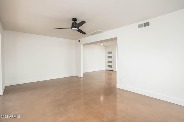 unfurnished room featuring concrete floors and ceiling fan