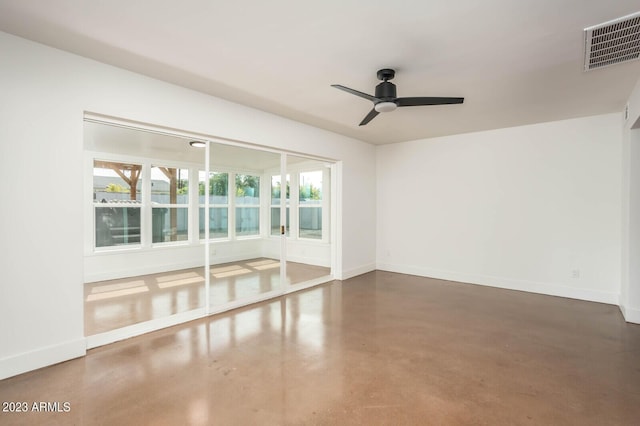 unfurnished room featuring concrete flooring and ceiling fan