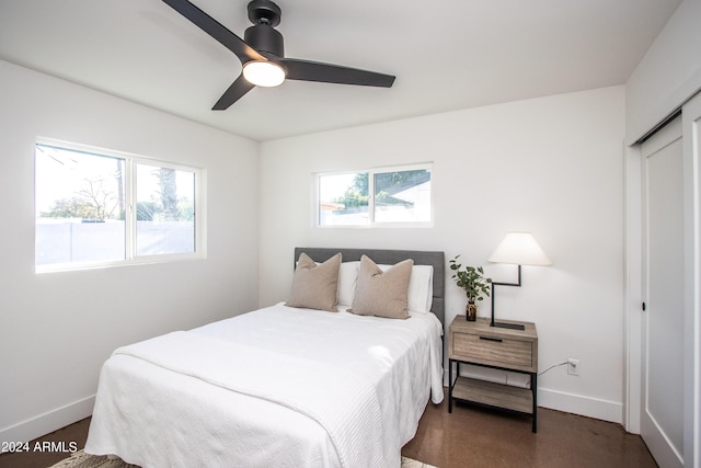 bedroom featuring ceiling fan and a closet