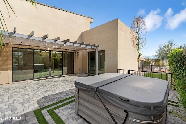 view of patio / terrace featuring a hot tub