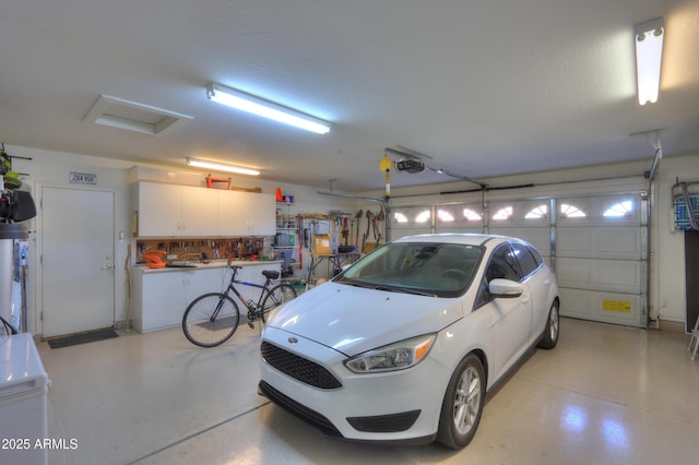 garage featuring a garage door opener