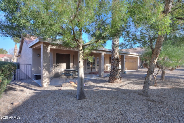 view of front facade with a patio area