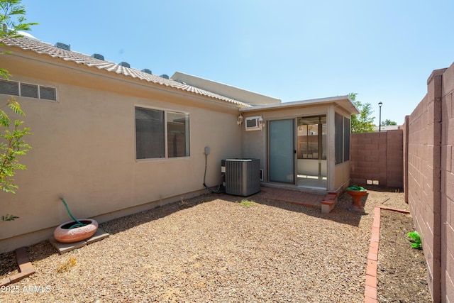 64 N 63rd St N Unit 33, Mesa, AZ 85205 - rear view of property featuring stucco siding, a fenced backyard, and a sunroom