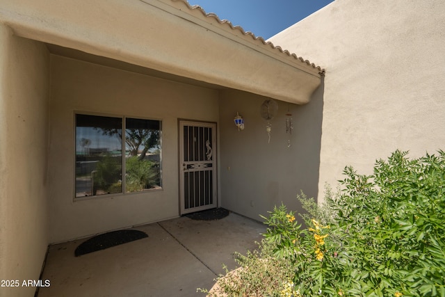 64 N 63rd St N Unit 33, Mesa, AZ 85205 - property entrance with a patio area and stucco siding