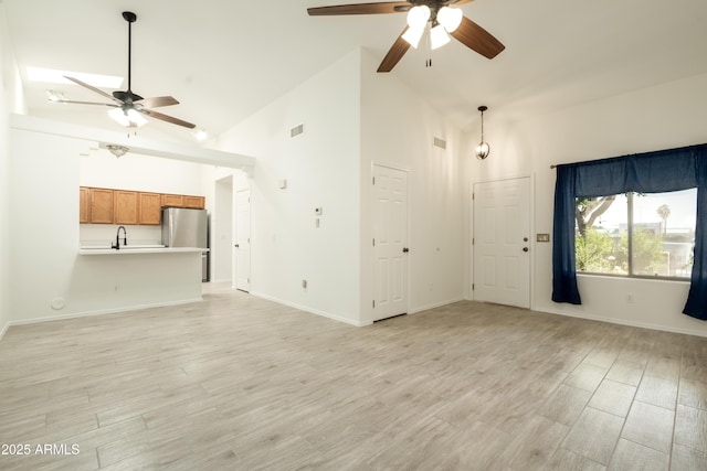 64 N 63rd St N Unit 33, Mesa, AZ 85205 - unfurnished living room with a ceiling fan, high vaulted ceiling, and light wood-type flooring