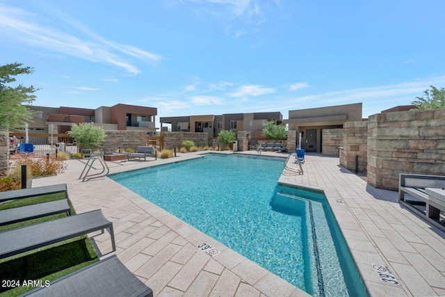 view of swimming pool with a patio