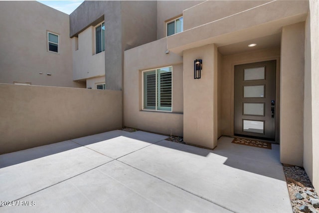 property entrance with a patio area