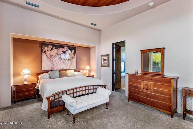 bedroom with carpet flooring and visible vents