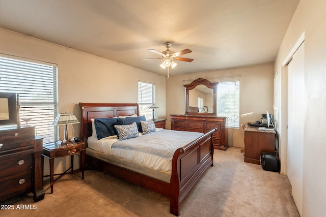 15211 N 89th Ave, Peoria, AZ 85381 - bedroom featuring multiple windows, light carpet, and ceiling fan