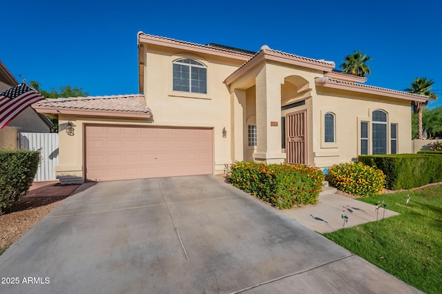 15211 N 89th Ave, Peoria, AZ 85381 - mediterranean / spanish-style home featuring a tile roof, concrete driveway, and stucco siding