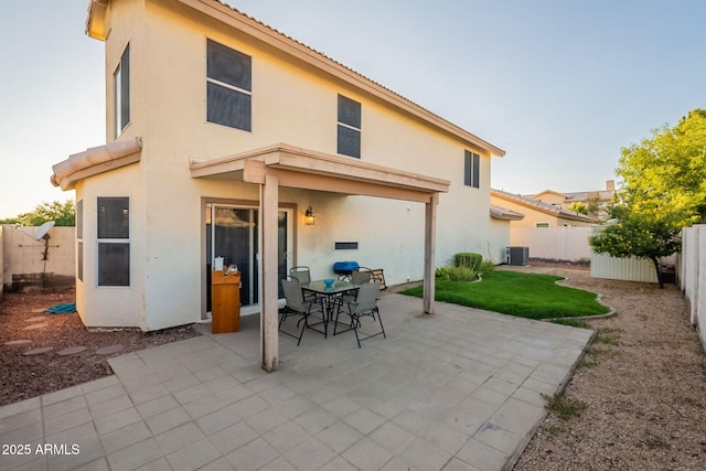 15211 N 89th Ave, Peoria, AZ 85381 - back of house with central AC unit, a patio, a fenced backyard, and stucco siding