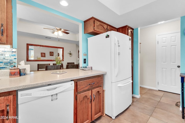 kitchen featuring light tile patterned floors, white appliances, and ceiling fan