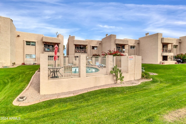 view of pool featuring a yard