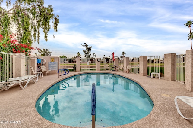 view of pool featuring a patio