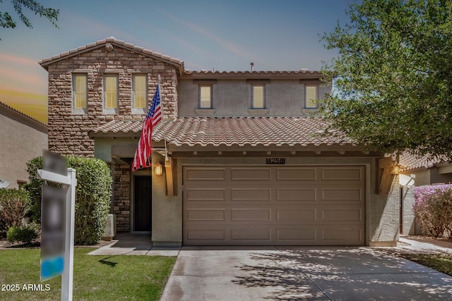 4258 E Lexington Ave, Gilbert, AZ 85234 - view of front of house with concrete driveway, stucco siding, a tiled roof, and an attached garage