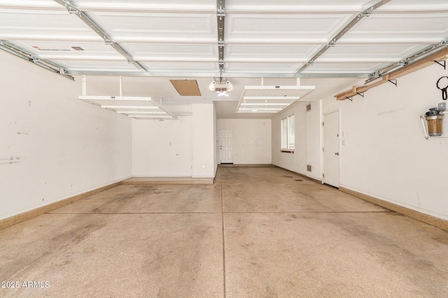 4258 E Lexington Ave, Gilbert, AZ 85234 - garage with baseboards and a garage door opener