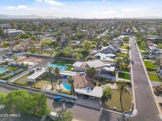 4461 E Flower St, Phoenix, AZ 85018 - aerial view of property's location featuring a pool area and nearby suburban area