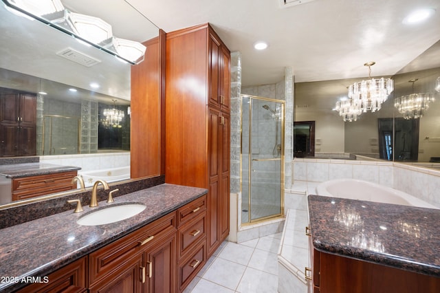 4461 E Flower St, Phoenix, AZ 85018 - bathroom featuring tile patterned floors, a shower stall, a bath, vanity, and recessed lighting