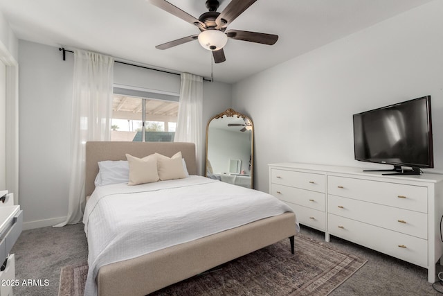 carpeted bedroom featuring baseboards and a ceiling fan