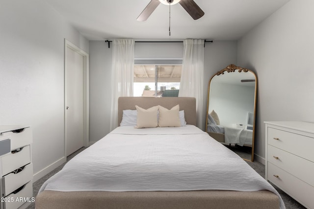 carpeted bedroom with a ceiling fan and baseboards