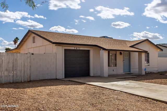 ranch-style home with a garage, driveway, a shingled roof, and fence