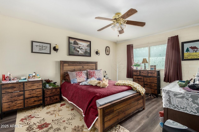 bedroom with ceiling fan and wood-type flooring