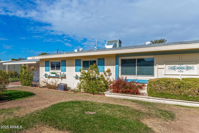 single story home featuring a front yard and central air condition unit