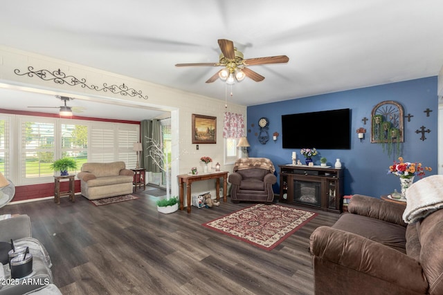 living room featuring dark hardwood / wood-style floors and ceiling fan