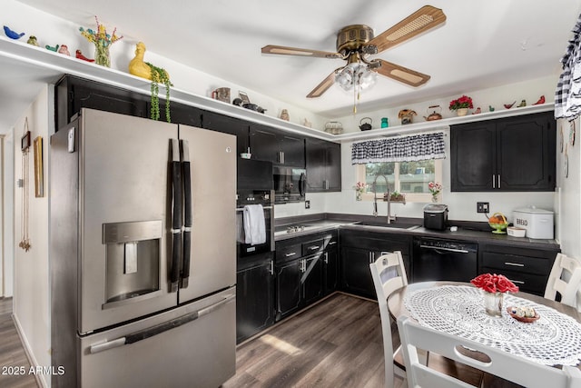 kitchen featuring appliances with stainless steel finishes, sink, dark wood-type flooring, and ceiling fan