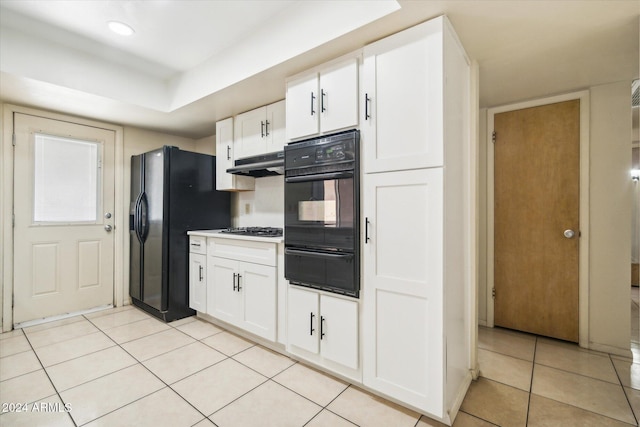 kitchen with black fridge with ice dispenser, white cabinets, light tile patterned flooring, and gas stovetop