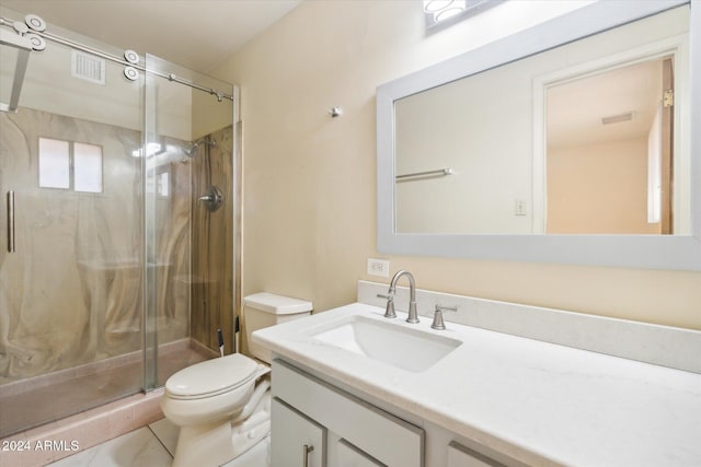 bathroom featuring walk in shower, tile patterned flooring, vanity, and toilet