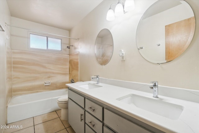 full bathroom featuring tile patterned floors, vanity, tiled shower / bath combo, and toilet