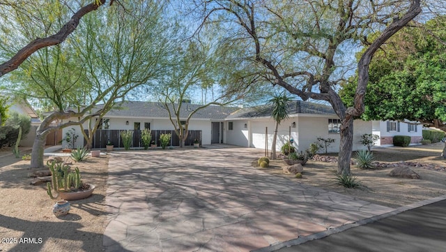 ranch-style house featuring a garage