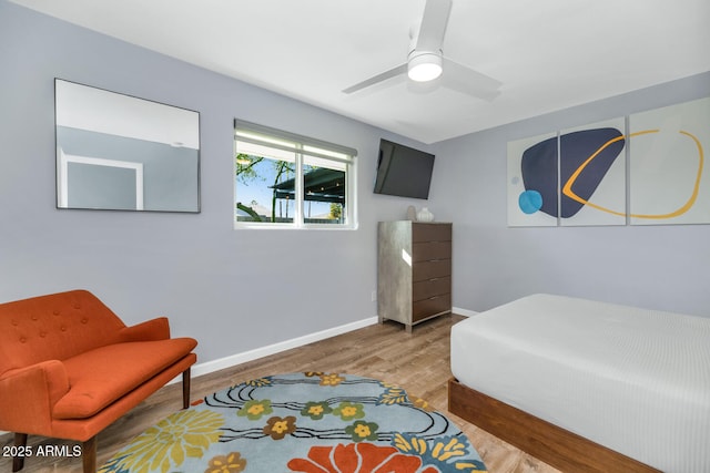 bedroom featuring wood-type flooring and ceiling fan