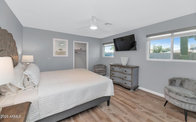 bedroom featuring a closet, ceiling fan, and light hardwood / wood-style flooring