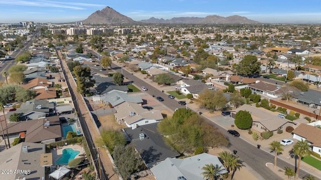 birds eye view of property featuring a mountain view