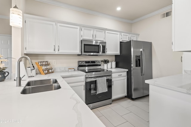 kitchen with white cabinets, pendant lighting, stainless steel appliances, and sink