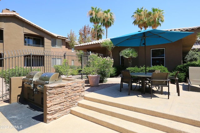 view of patio featuring grilling area and exterior kitchen