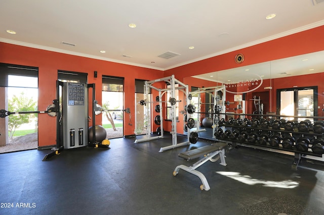 gym featuring crown molding