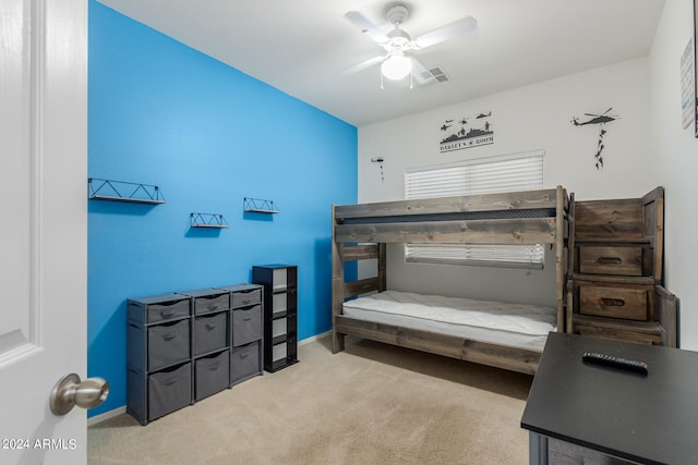 bedroom featuring ceiling fan and light carpet